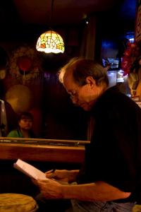 Bangkok Noir Artist, Chris Coles prepares for presentation - Photo by Aroon Thaewchattura